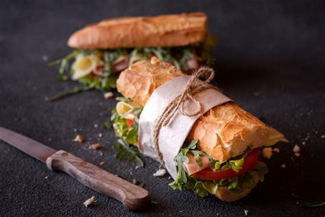 Premium Photo Baguette Sandwich With Cheese Ham Tomatoes And Vegetables