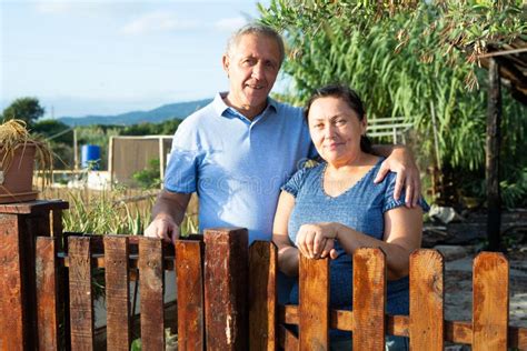 Portrait Of Positive Mature Couple In Garden Outdoors Stock Image Image Of American Person
