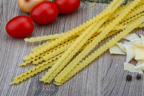 Mafalde pasta on wood 12773327 Stock Photo at Vecteezy