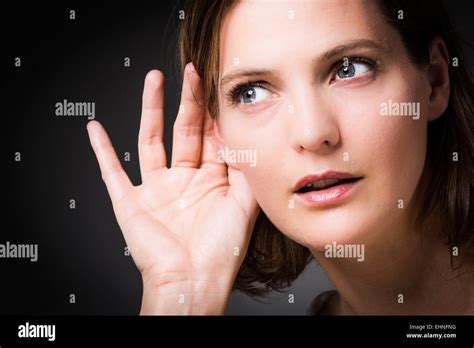 Holding To Ear Hi Res Stock Photography And Images Alamy