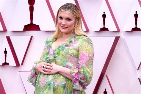 Pregnant Emerald Fennell debuts baby bump at Oscars 2021