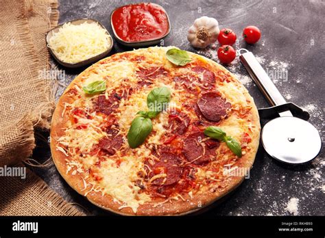 Italian Pizza With Salami Peperoni With Melted Cheese Red Tomatoes