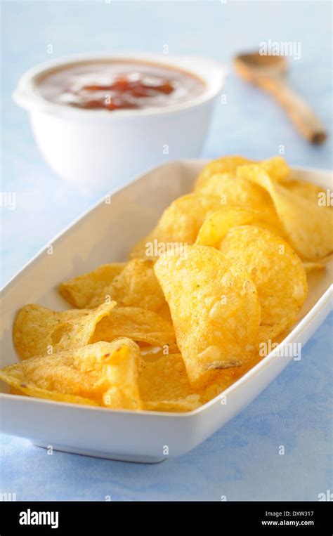 Crisps And Spicy Tomato Salsa Stock Photo Alamy