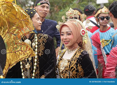 A Man and a Woman Wearing Traditional Javanese Wedding Clothes in Order ...