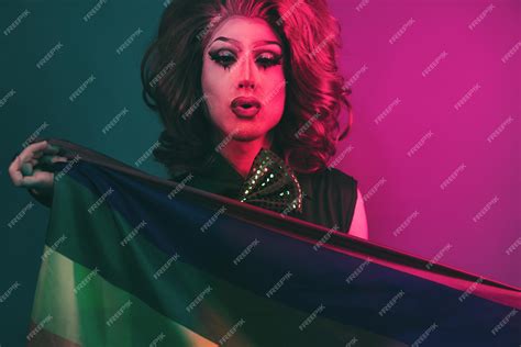 Premium Photo Drag Queen Holding Lgbt Rainbow Flag Inside Color Light