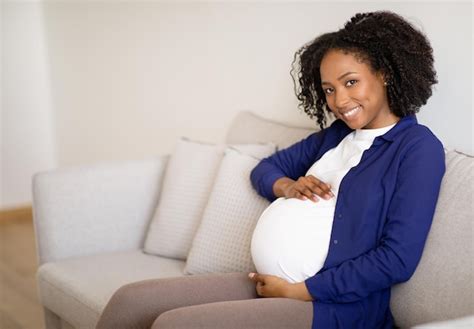 Premium Photo Glad Young African American Pregnant Woman In Casual