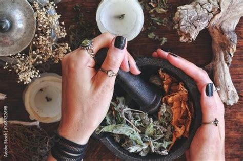 Kitchen Witchery Female Wiccan Witch Holding Pestle And Mortar In Her Hands Making Magickal