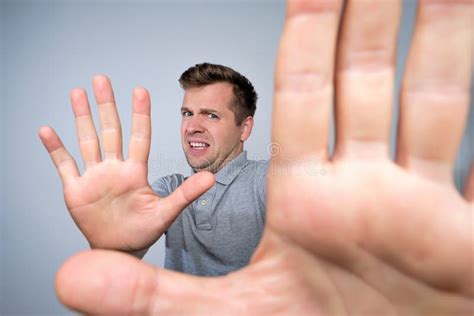 Man Shows Refusal Gesture Does Not Want To Participate In Meeting