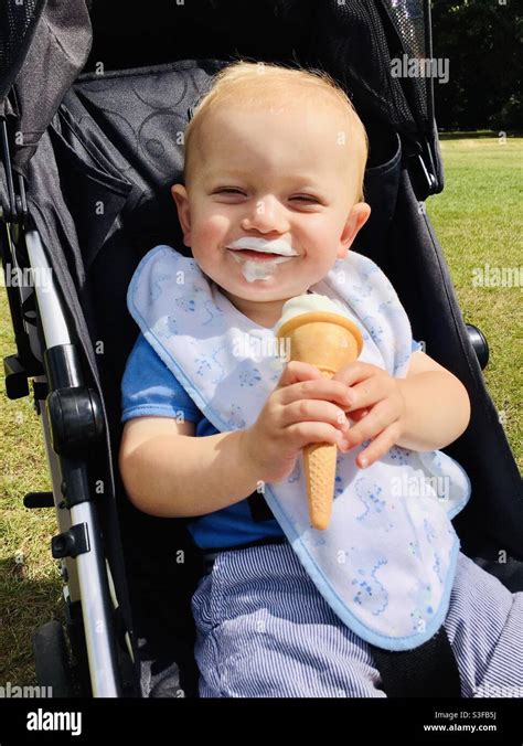 Baby eating ice cream Stock Photo - Alamy