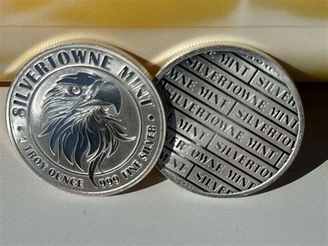 2) Silvertown Mint Coins 1 Troy Ounce Each .999 Fine Silver - Prime Time Auctions, Inc.