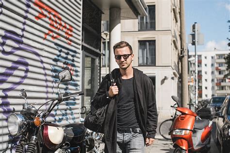 Good Looking Man Walking Down The Street By Stocksy Contributor