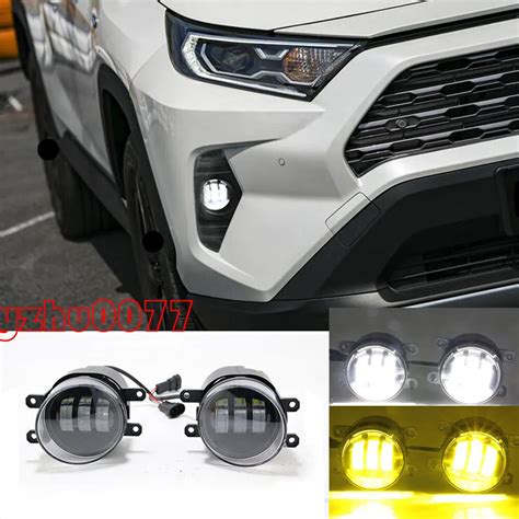 19 20 TOYOTA RAV4 FRONT BUMPER DRIVING FOG LIGHTS LAMP YELLOW W BEZEL