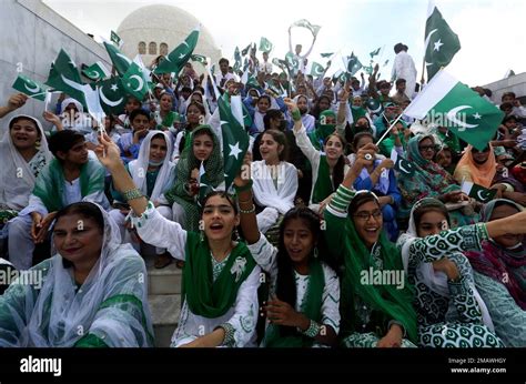 People Wave Pakistani Flags At The Mausoleum Of Muhammad Ali Jinnah