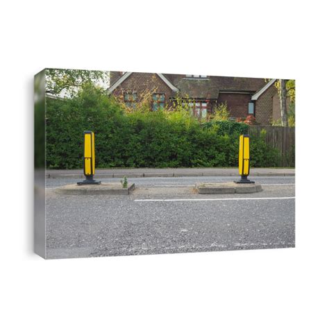 Safety Bollards At Pedestrian Crossing In England Canvas Print