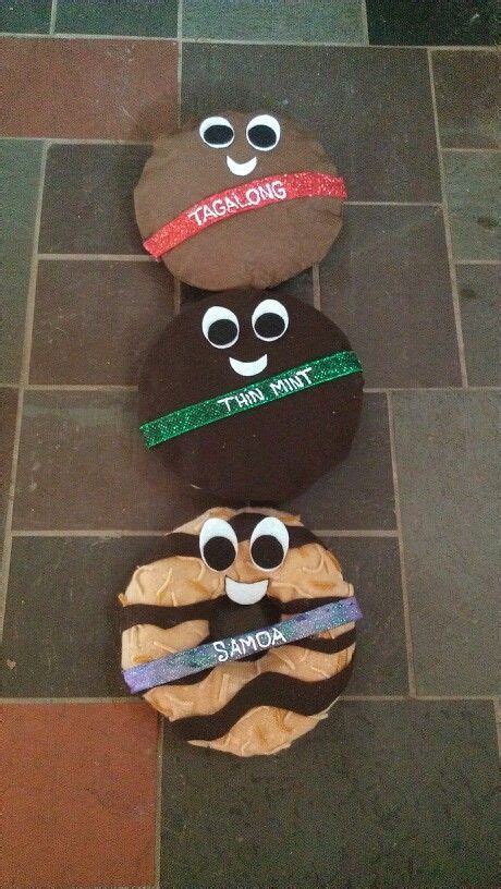 Three Rocks With Faces Painted On Them Sitting On A Tile Floor