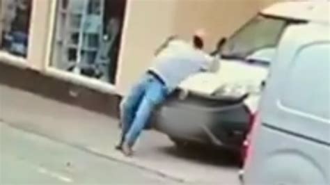 Man Pretends Getting Hit By Oncoming Car And Falls Down Dramatically