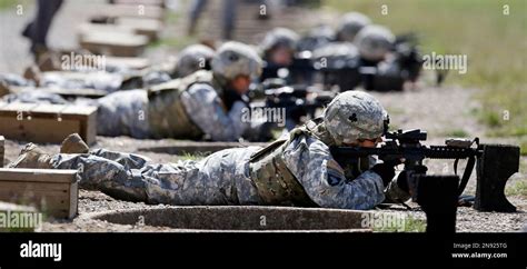 Female Soldiers Train On A Firing Range While Wearing New Body Armor On