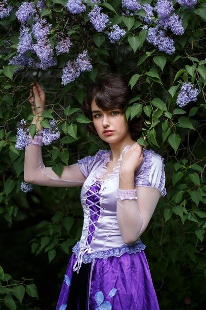 Premium Photo Portrait Of A Young Woman And A Lilac Bush