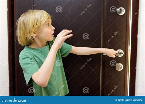 Little Boy Alone at Home. Child is Opening the Door To Someone. Baby is ...