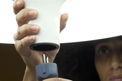 Ufo Like Pendant Lamp Hides A Power Socket That Turns Any Table Into A