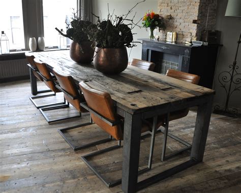 A Wooden Table With Chairs And Vases On It