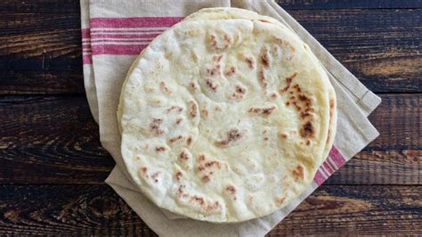 Two Tortillas Sitting On Top Of Napkins