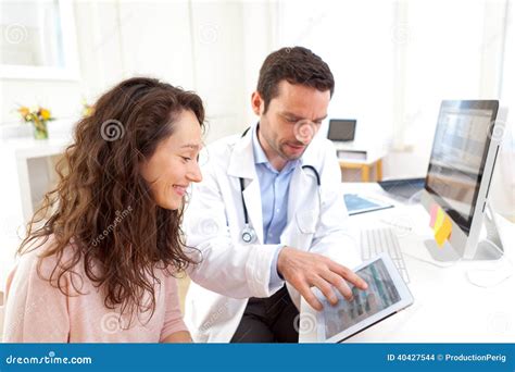 Doctor Using Tablet To Inform Patient Stock Photo - Image of ...