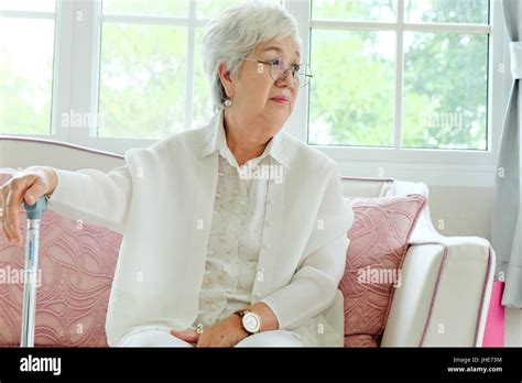 Retired Woman With Her Walking Stick Stock Photo Alamy