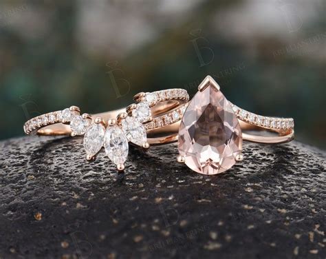 Two Engagement Rings With An Morganite And Diamond Setting On Top Of