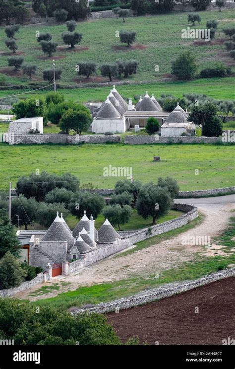 Italy, Puglia, Locorotondo, Trulli houses in landscape Stock Photo - Alamy