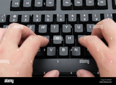 Male Typing A Black Keyboard Stock Photo Alamy