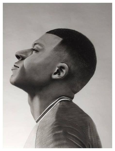 a black and white photo of a man's head with his hair styled up