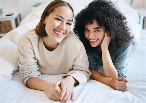 Premium Photo Love Smile And Portrait Of Lesbian Couple On Bed For Bonding Resting And