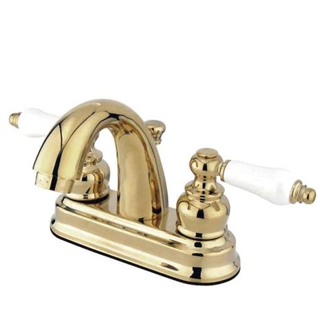 Kingston Brass Restoration 4 In Centerset 2 Handle Bathroom Faucet With Plastic Pop Up In