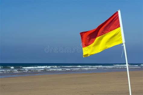 Safety Flag on a Beach stock photo. Image of coastline - 3233692