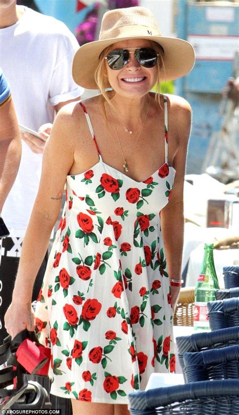 Lindsay Lohan Wears A Floral Dress As She Hops Onto Boat In Naples