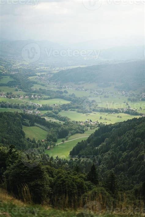 Majestic mountains in the Alps covered with trees and clouds 20498407 ...