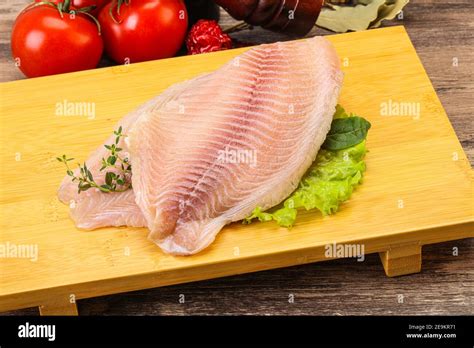 Raw Tilapia Fish Fillet For Cooking Stock Photo Alamy