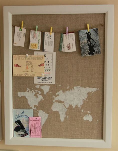 A Bulletin Board With Pins And Magnets Attached To It Hanging On A Wall