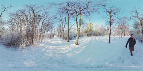 Man Walking Through Snowy Forest In 360 Degrees Stock Footage Video