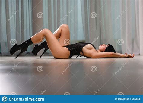 Slim Brunette In A Black Exotic Dancer Suit And Shoes Posing In A Studio Stock Image Image Of
