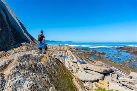 Premium Photo A Man Next To The Marine Vegetation In Algorri Cove On