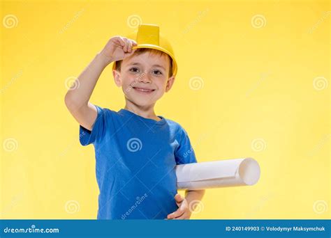 A Little Boy Holding Plan Project In His Hands Dreams Of Becoming A