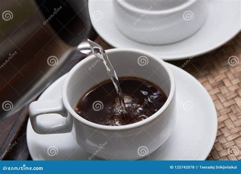 Pouring Hot Water From A Kettle Into A Coffee Cup Stock Photo Image Of Kettle Food
