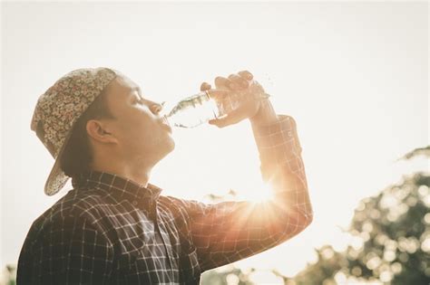 Premium Photo Portrait Of Man Drinking Glass Against Clear Sky