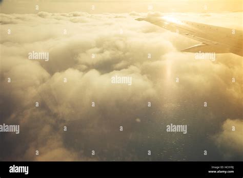 Clouds And Sky With Wing Through Window Of An Aircraft Stock Photo Alamy