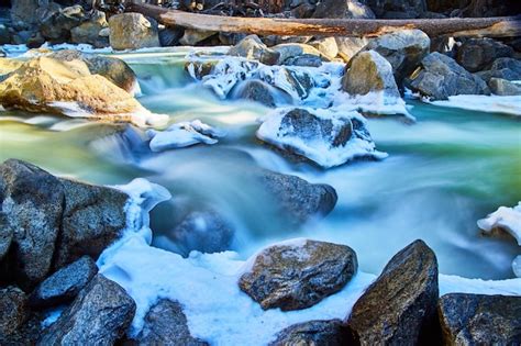 Premium Photo Early Spring Detail Of River Cascading Falls Over Rocks