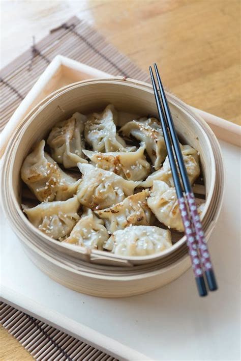 Traditional Dumplings with Chopsticks on Tray · Free Stock Photo