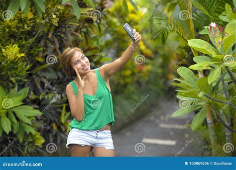 Young Sweet And Pretty Asian Woman Holding Mobile Phone Taking Selfie