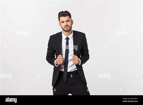 Portrait Of Confident Mature Businessman In Formals Standing Isolated Over White Background